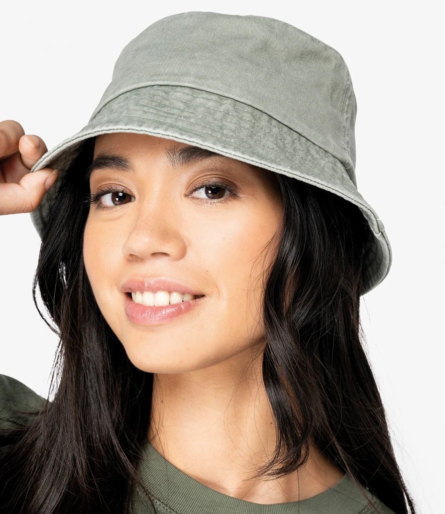 Model wearing a washed khaki Native Spirit Faded Bucket Hat