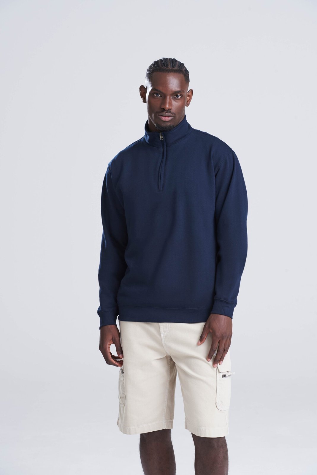 Model wearing a navy AWDis Sophomore 1/4 zip sweatshirt, front view